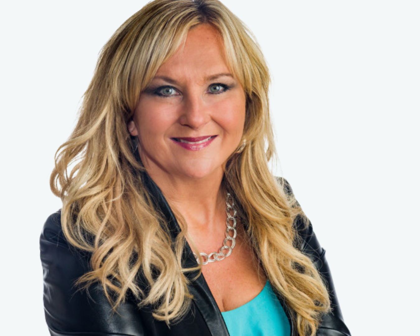 Blonde woman with a blue top and black jacket